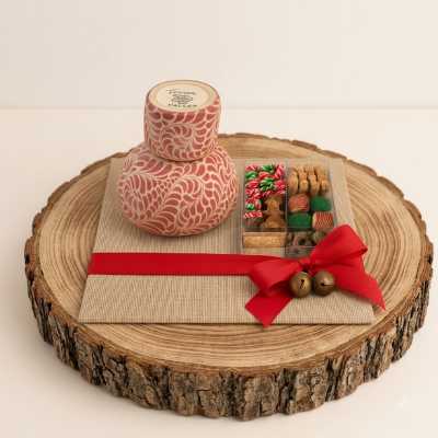 Set de regalo corporativo con botella de talavera contemporánea rosa, snacks gourmet y moño rojo